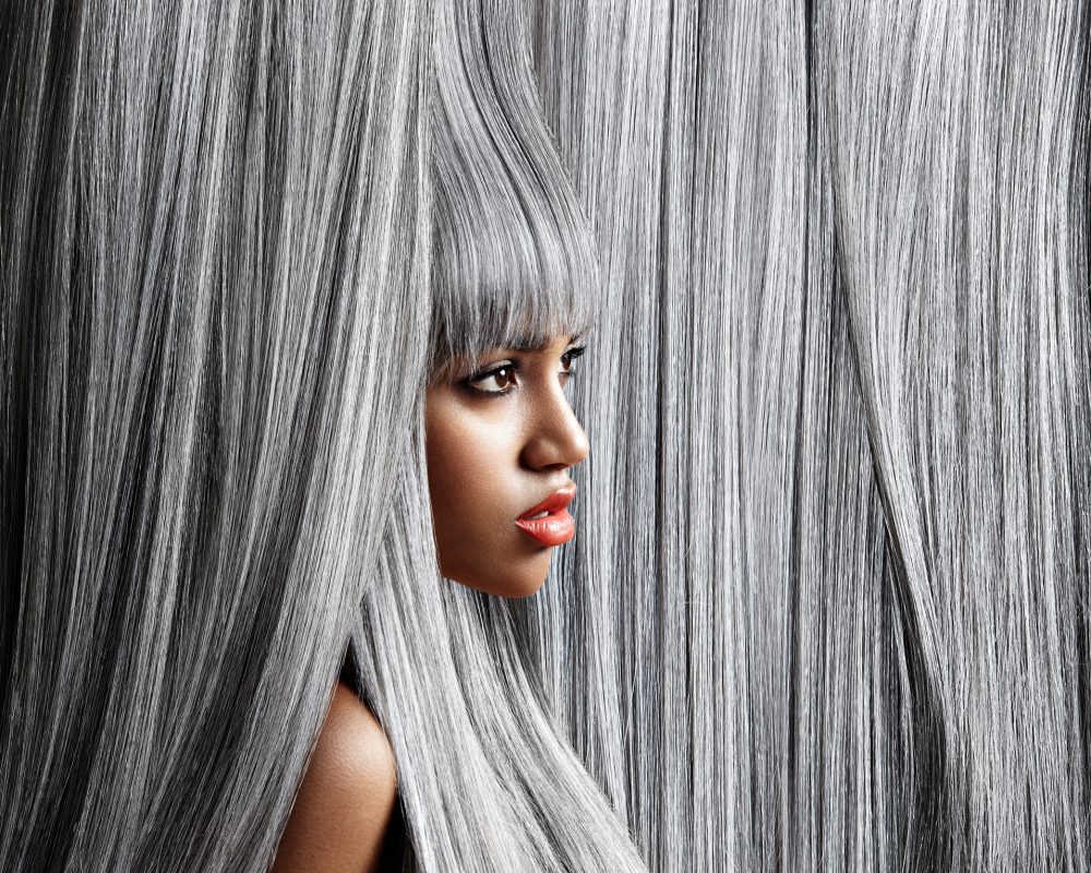 woman's profile in trendy grey hair background
